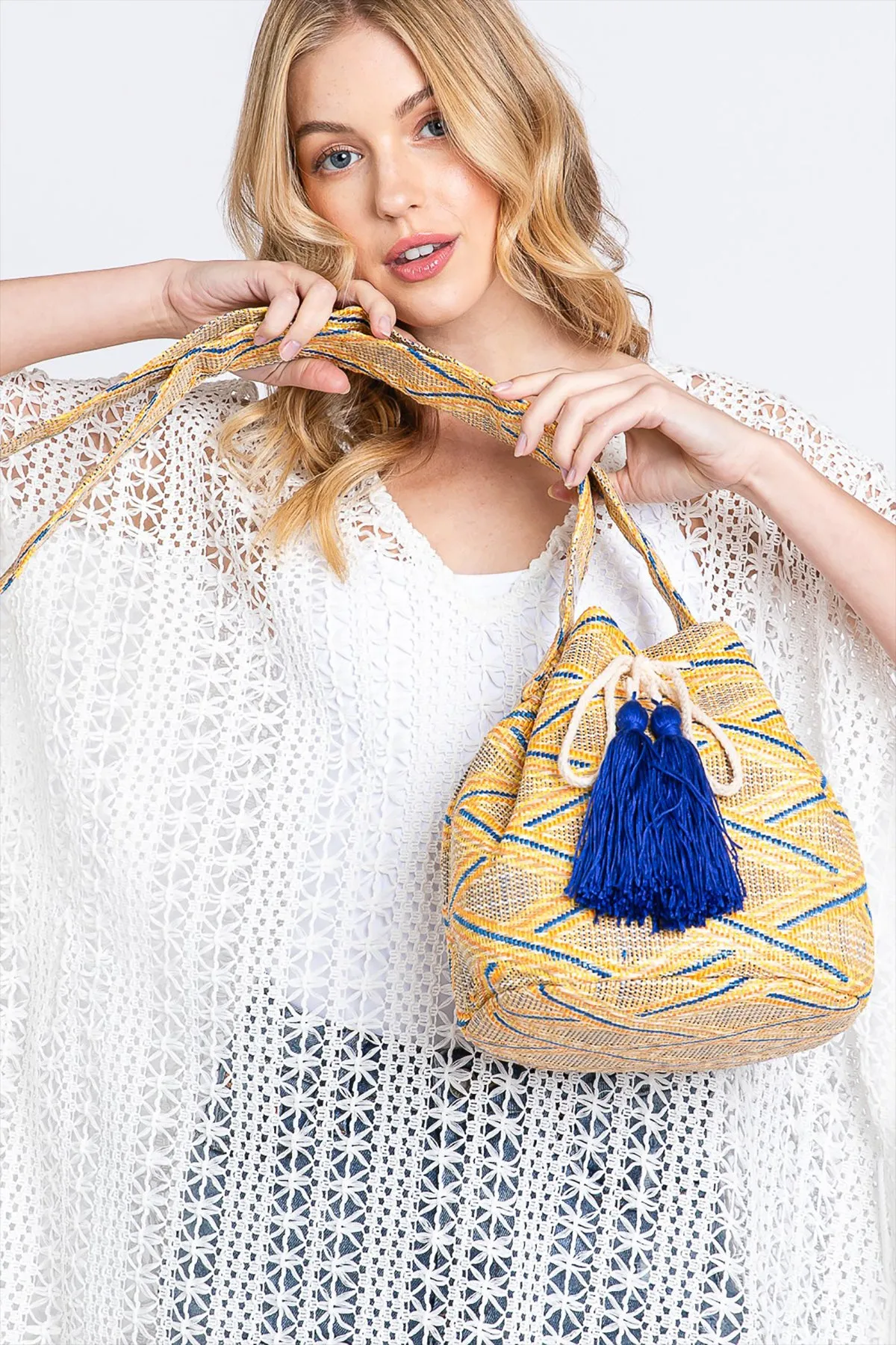 SOLID BUCKET BAG WITH AZTEC STRAP